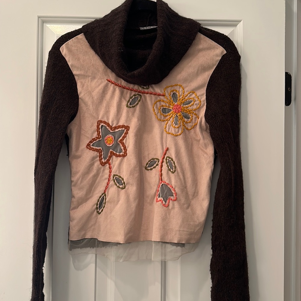 Sweater with suede front.